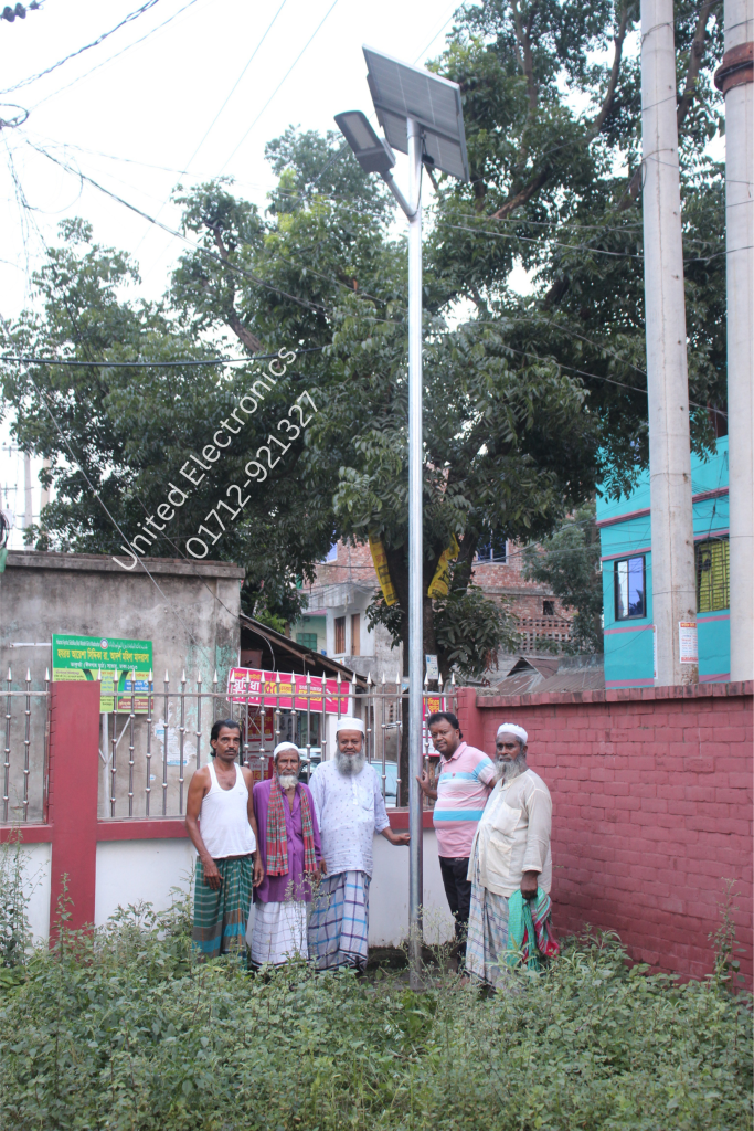 Solar street light and panel installed beside a compound entrance