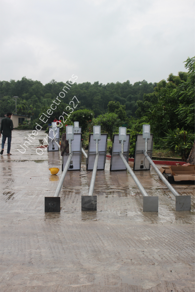 Street light poles and fixtures arranged on the ground