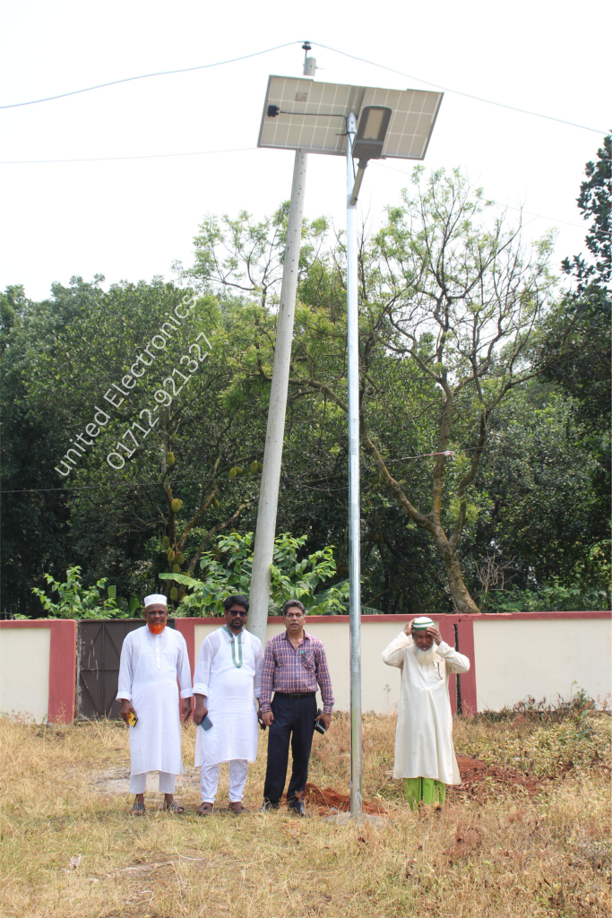 Solar street light installation with a panel mounted above the lamp