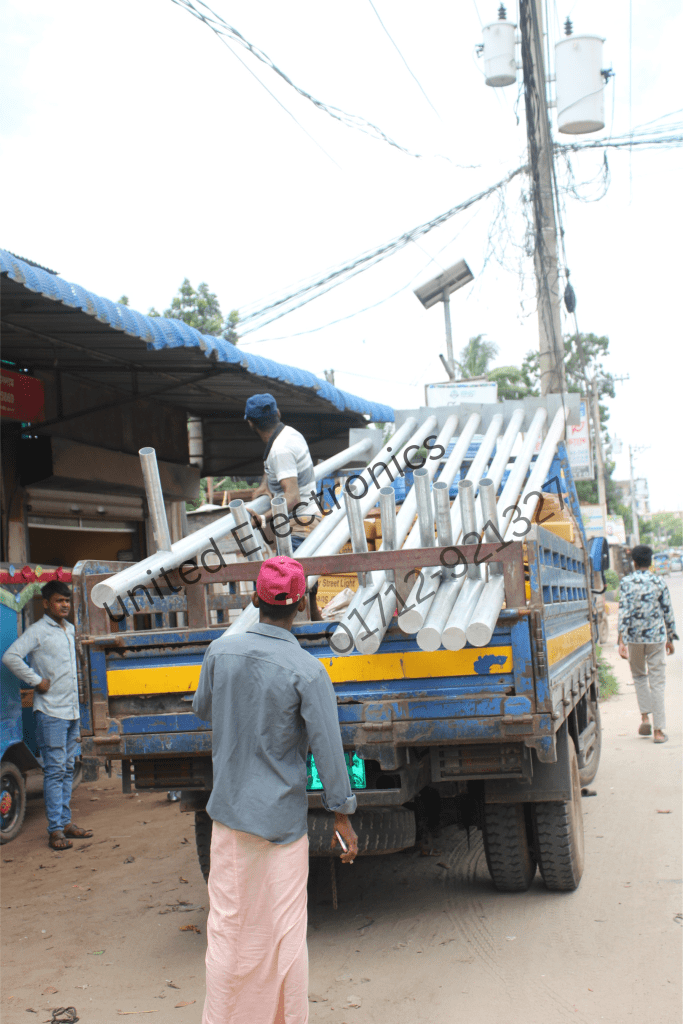 Street light poles and lighting equipment loaded on a truck